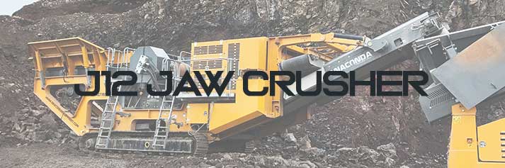 Anaconda J12 Mobile Jaw Crusher system and chamber with conveyor working at a Quarry site processing materials, stone and crushing rocks